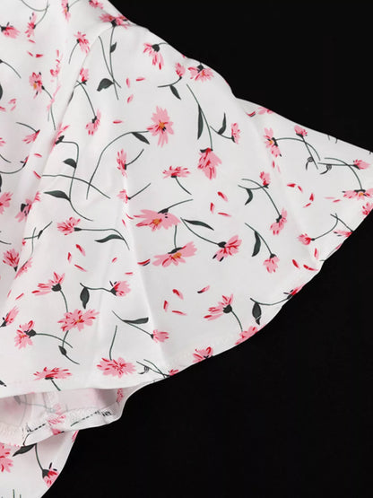 Dusty pink floral print V-neck midi dress with flutter sleeves by Trendsi, showcasing a flowy, feminine design.