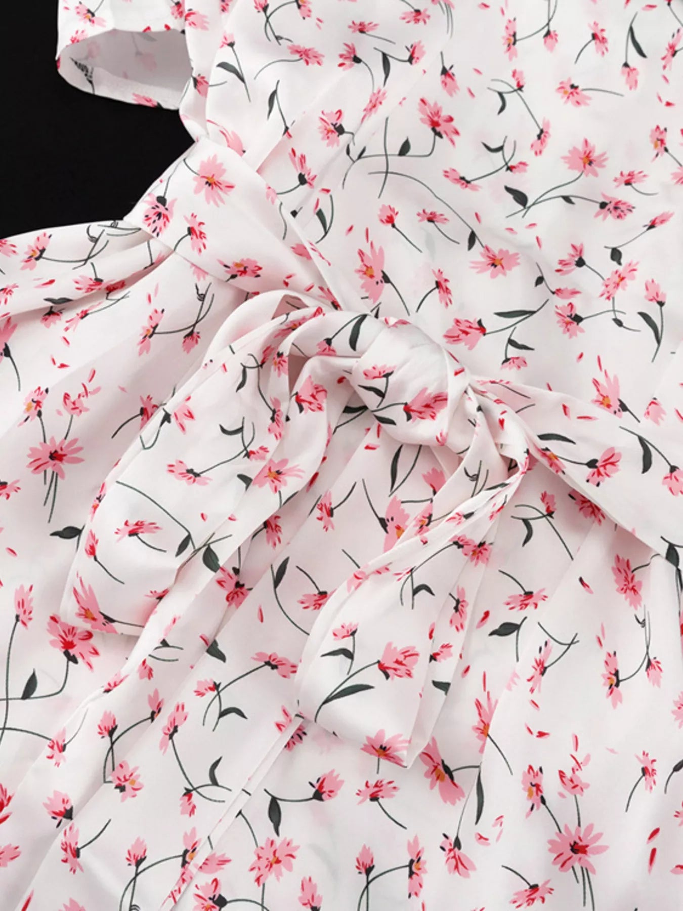Dusty pink floral print V-neck midi dress with flutter sleeves from Trendsi, showcasing a stylish flowy design.