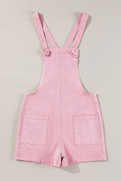 Dusty pink denim overalls with knot straps and front pockets by Trendsi, featuring a casual, relaxed fit.