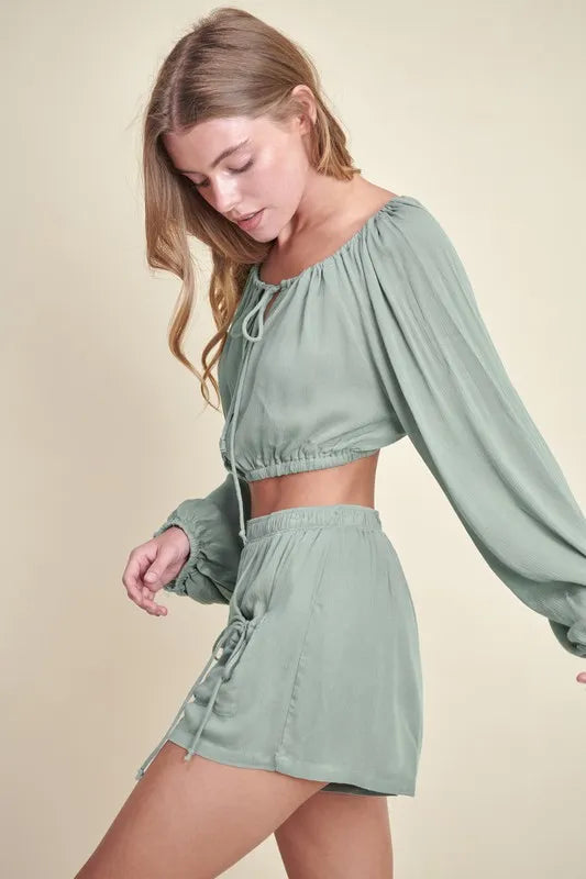 Dusty sage MABLE Gauze long sleeve crop top and short set by Trendsi, featuring button details and lightweight fabric.
