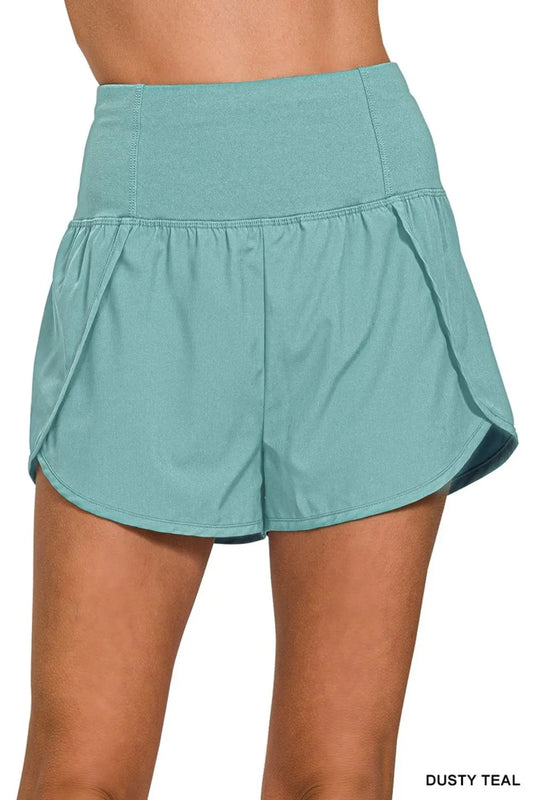 Dusty teal Zenana high-waisted running shorts with zippered back pocket and comfortable fit, ideal for active workouts.