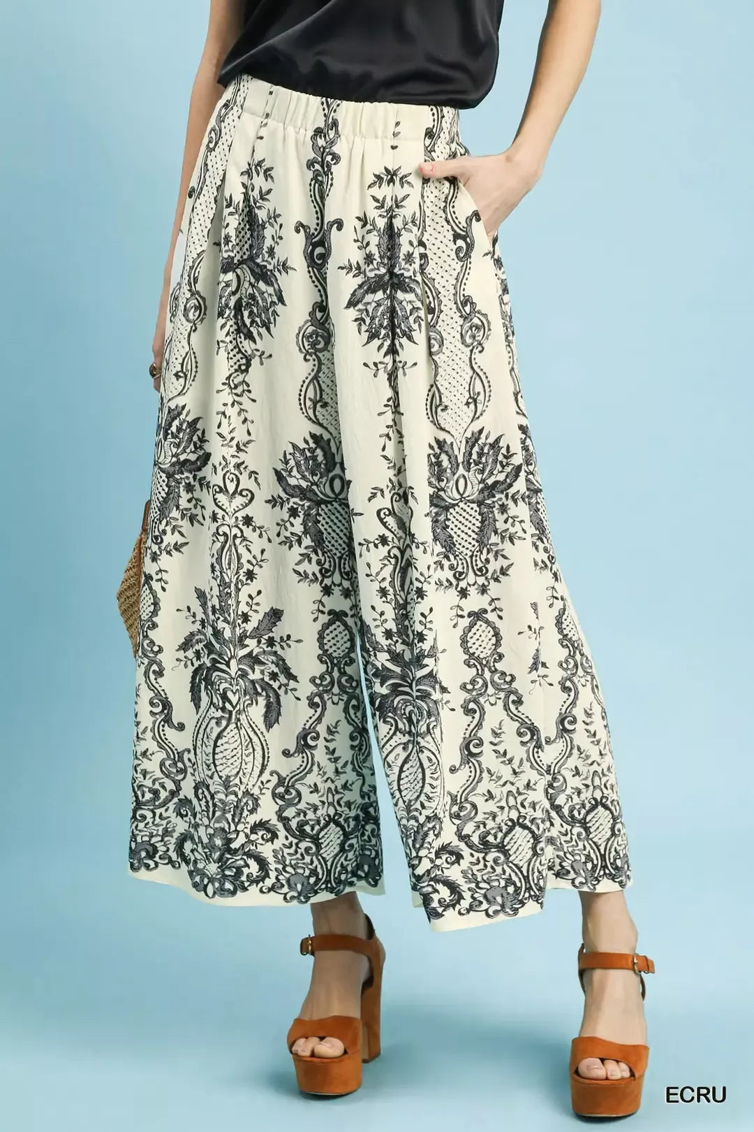 Ecru Umgee border print wide leg pants from Trendsi featuring a relaxed fit and stylish wide-leg silhouette.
