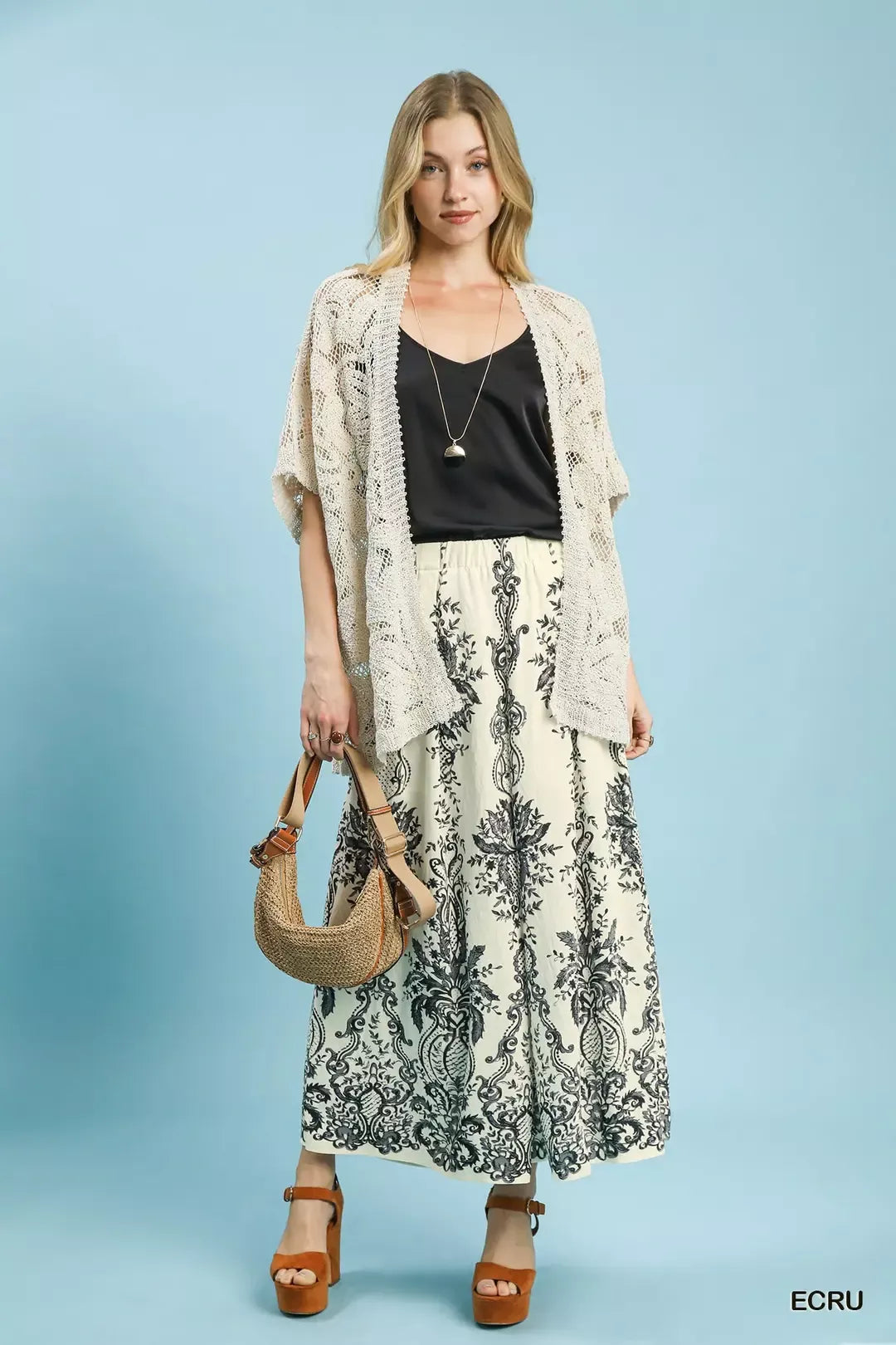 Ecru Umgee border print wide leg pants from Trendsi, featuring a relaxed fit and stylish pattern for casual wear.