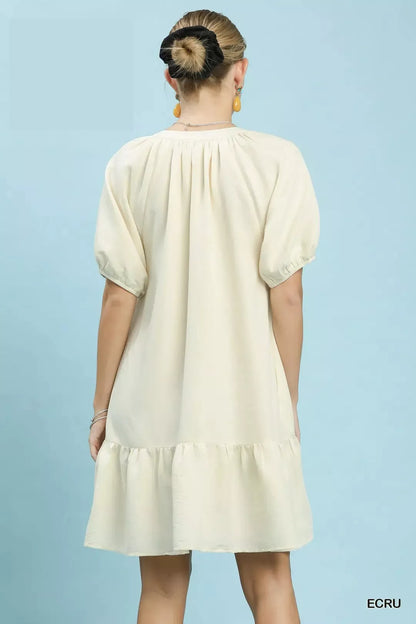 Ecru Umgee embroidered floral babydoll dress with delicate embroidery and a flowy silhouette, perfect for casual or dressy occasions.