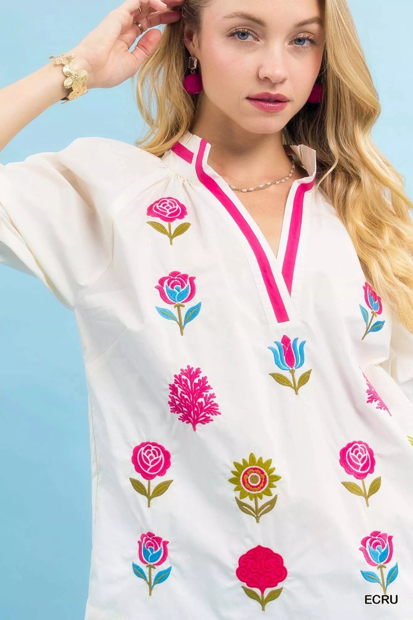 Ecru Umgee embroidered floral top with contrast trim, featuring intricate embroidery and relaxed fit, stylish women's casual blouse.