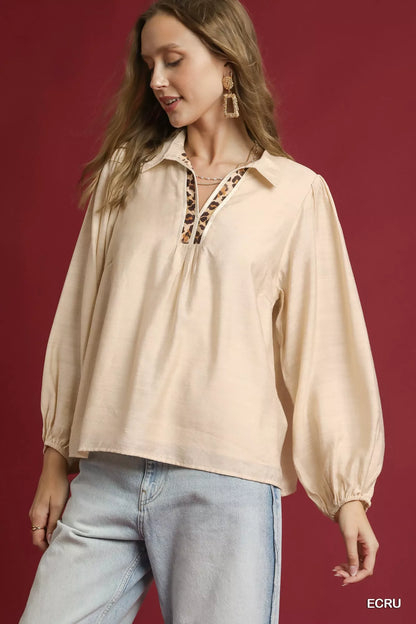 Ecru long sleeve blouse by Umgee with leopard print trim, featuring a relaxed fit and stylish details.