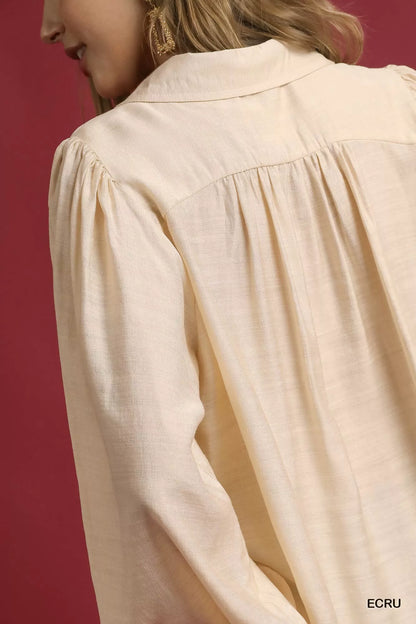 Ecru long sleeve blouse by Umgee with leopard print trim, featuring a relaxed fit and stylish design.