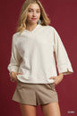 Ecru textured knit V-neck top by Umgee featuring a relaxed fit and soft fabric, ideal for casual and stylish looks.