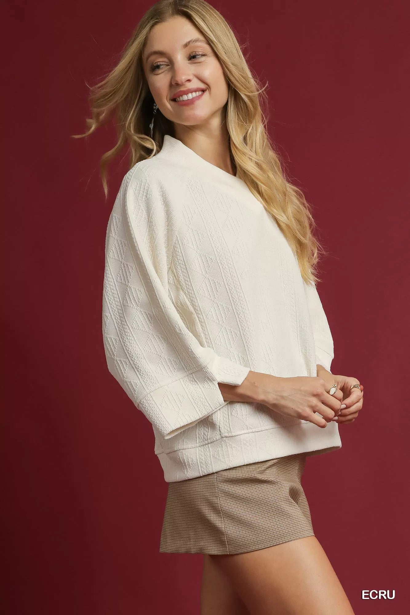 Ecru textured knit V-neck top by Umgee, featuring a cozy, stylish design perfect for casual wear.