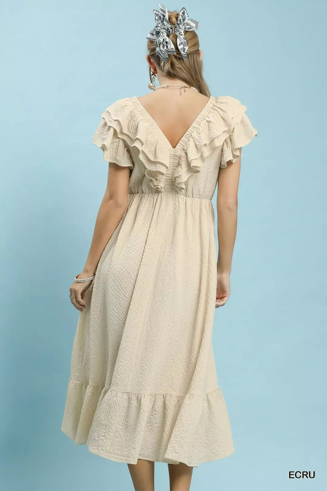 Ecru textured ruffle midi dress by Umgee, showcasing a flowy design with ruffle details for a stylish, feminine look.