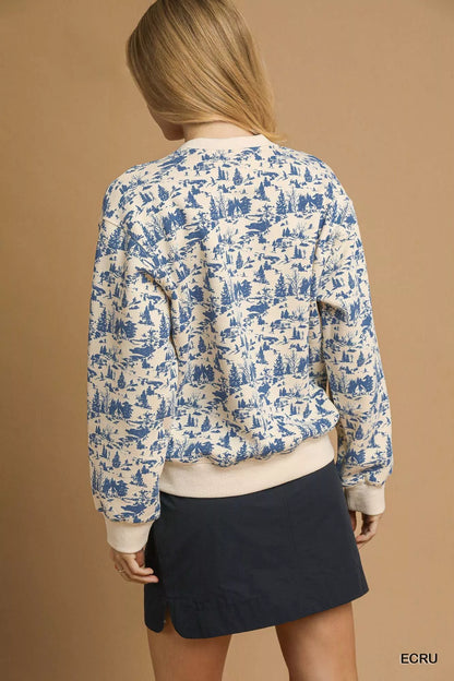 Ecru Umgee scenic print cropped sweatshirt by Trendsi, featuring a colorful nature-inspired design and relaxed fit.