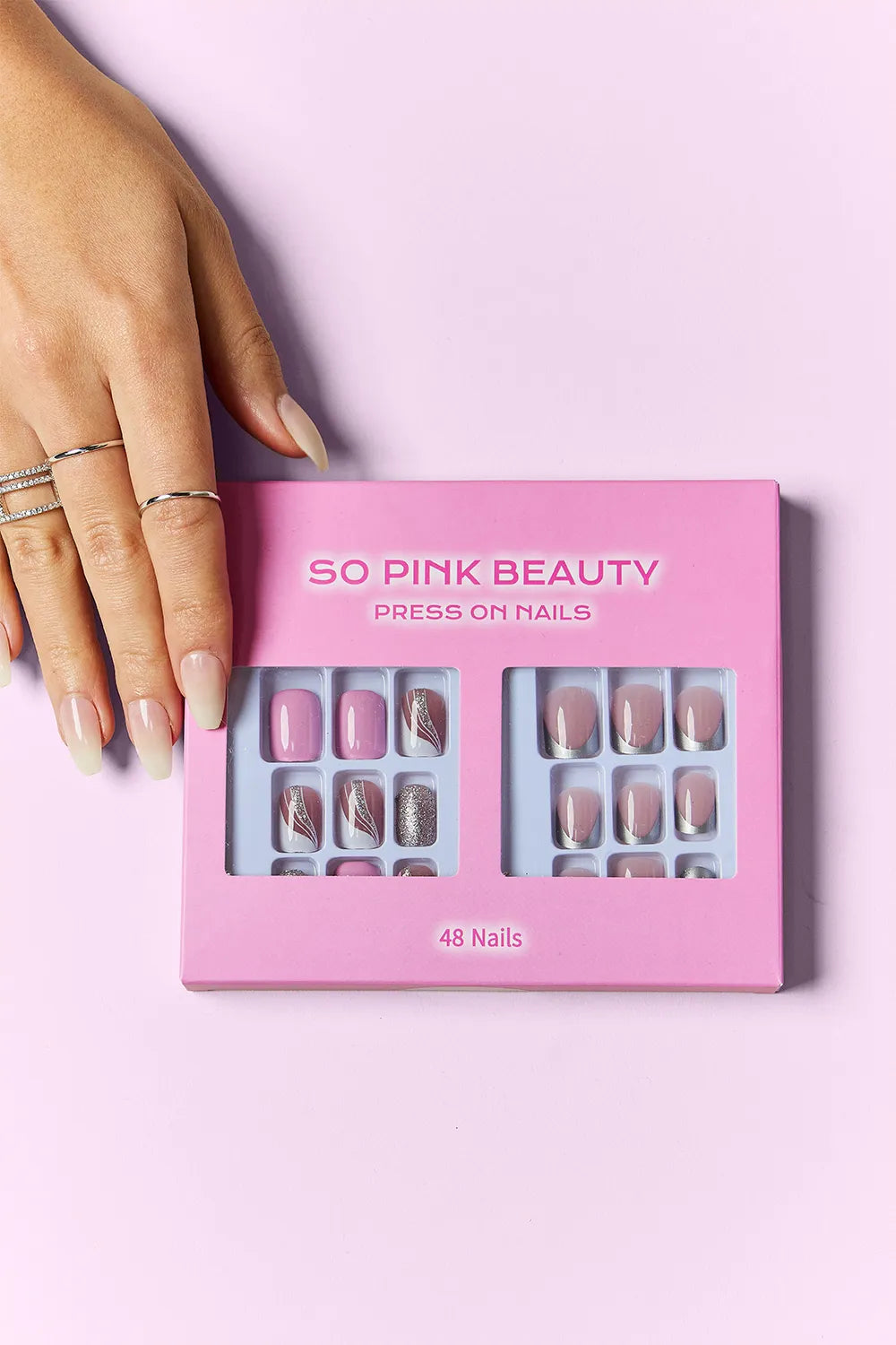 Two packs of Trendsi SO Pink Beauty press-on nails with elegant, natural-looking pink designs for easy, stylish manicures.