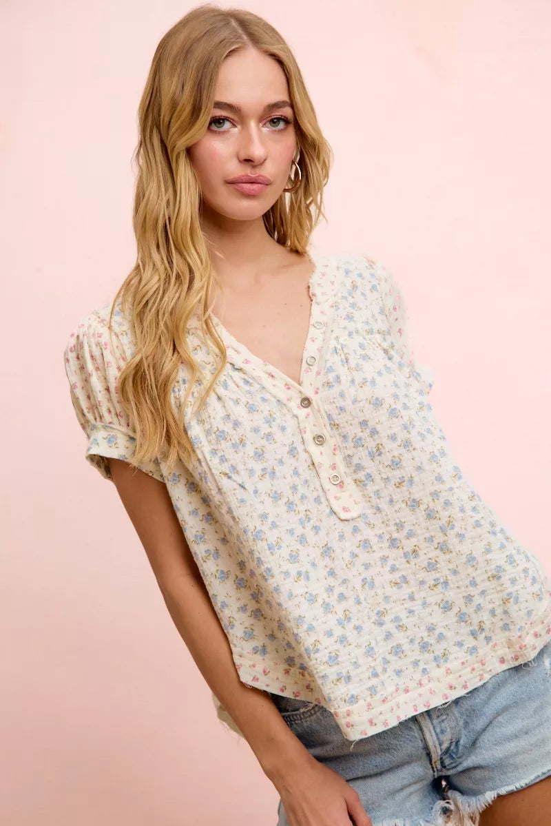 Trendsi BiBi floral crinkle short sleeve blouse with a neckdrop design, featuring a colorful floral pattern and lightweight fabric.