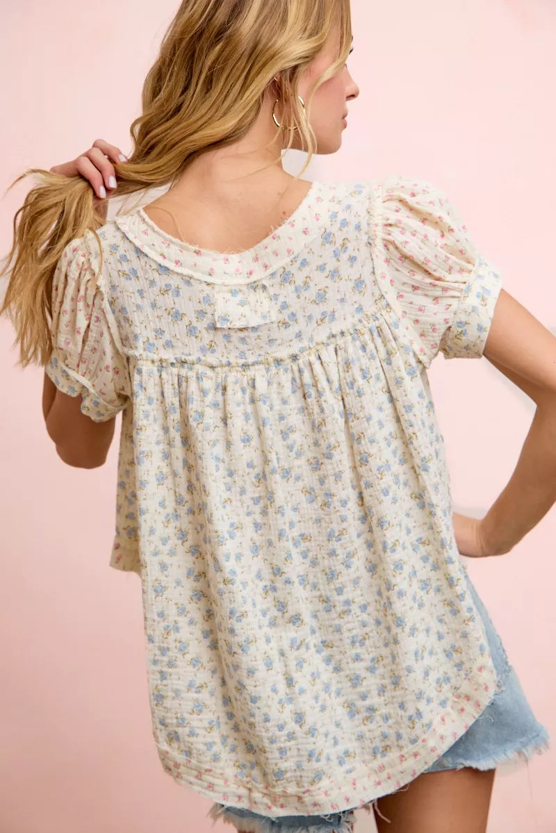 Trendi BiBi floral crinkle short sleeve blouse with a neckdrop design, lightweight fabric, and vibrant floral pattern.