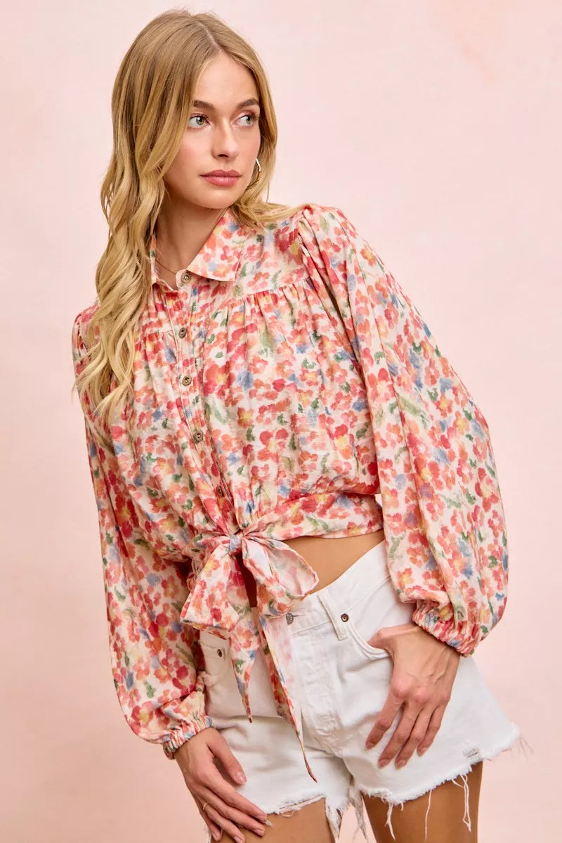 Trendi BiBi floral print crop shirt with tie hem detail, short sleeves, and vibrant flower pattern for a stylish summer look.