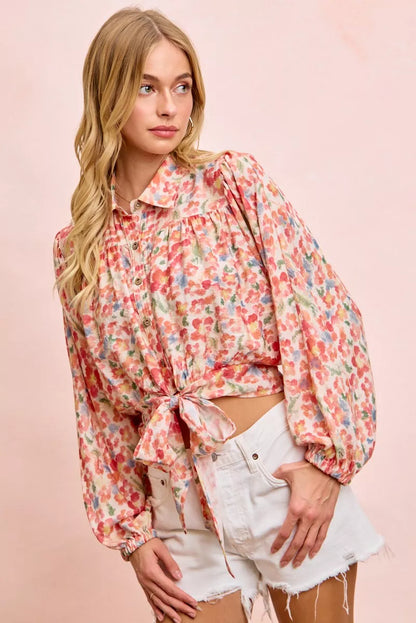 Trendi BiBi floral print crop shirt with tie hem detail, short sleeves, and vibrant flower pattern for a stylish summer look.