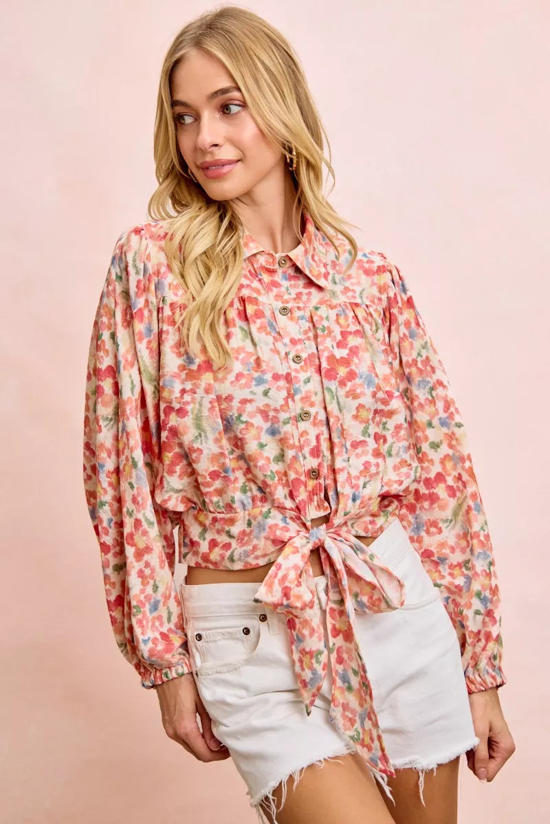 Trendsi BiBi floral print crop shirt with tie hem detail, featuring vibrant floral pattern and lightweight fabric.