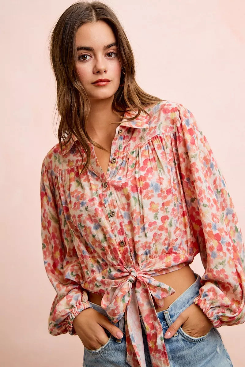 Trendsi BiBi floral print crop shirt with tie-hem detail, featuring a vibrant floral pattern and casual short-sleeve design.