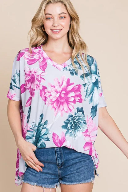 Trendsi BOMBOM floral V-neck short sleeve T-shirt with colorful floral print on soft fabric for a casual, stylish look.
