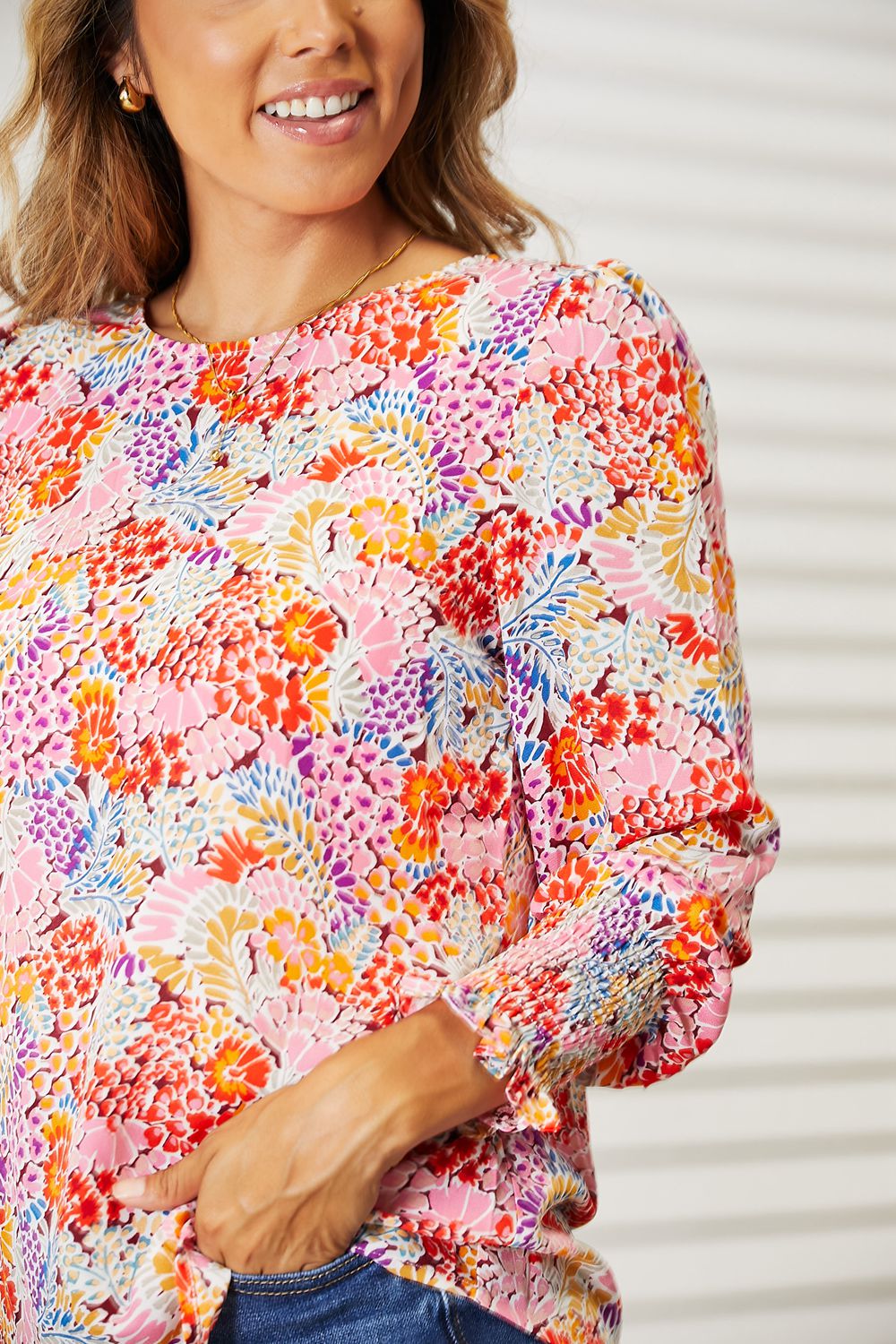Floral print long puff sleeve blouse from Trendsi with ruffled neckline and flowy fabric, perfect for casual or dressy wear.
