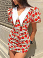Floral print mini dress with ruched details and puff sleeves, trendy women's fashion by Trendsi in a vibrant floral design.