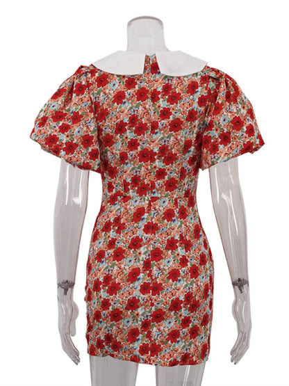 Floral print ruched mini dress with puff sleeves, featuring a fitted silhouette and vibrant flower pattern, by Trendsi.