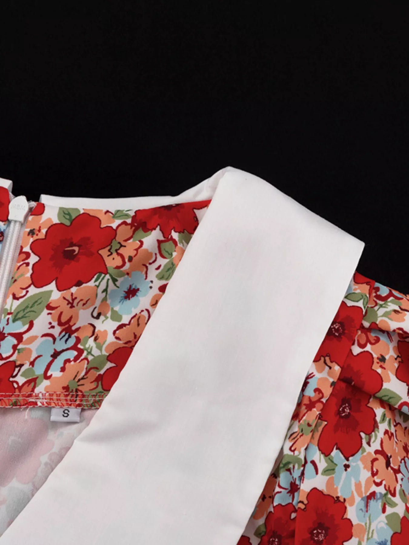 Floral print ruched mini dress with puff sleeves from Trendsi, showcasing a fitted bodice and vibrant floral pattern.