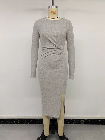 Gray ribbed knit twist front long sleeve midi dress with slit, by Trendsi, featuring a fitted silhouette and stylish design.