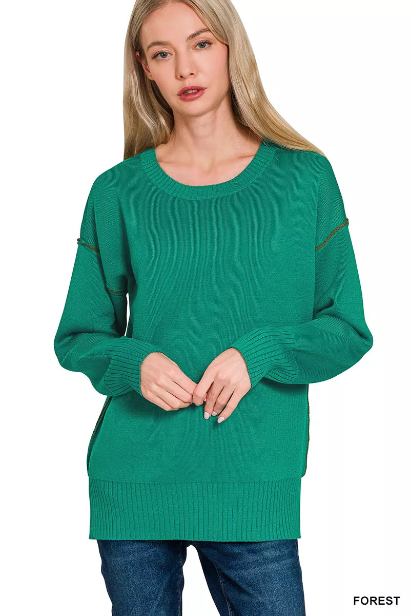Forest green Zenana round neck sweater with contrast trim, featuring long sleeves and a cozy knit fabric.
