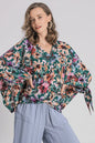 Plus size floral V-neck tie sleeve blouse by Umgee, featuring a relaxed fit and vibrant floral print, perfect for casual wear.