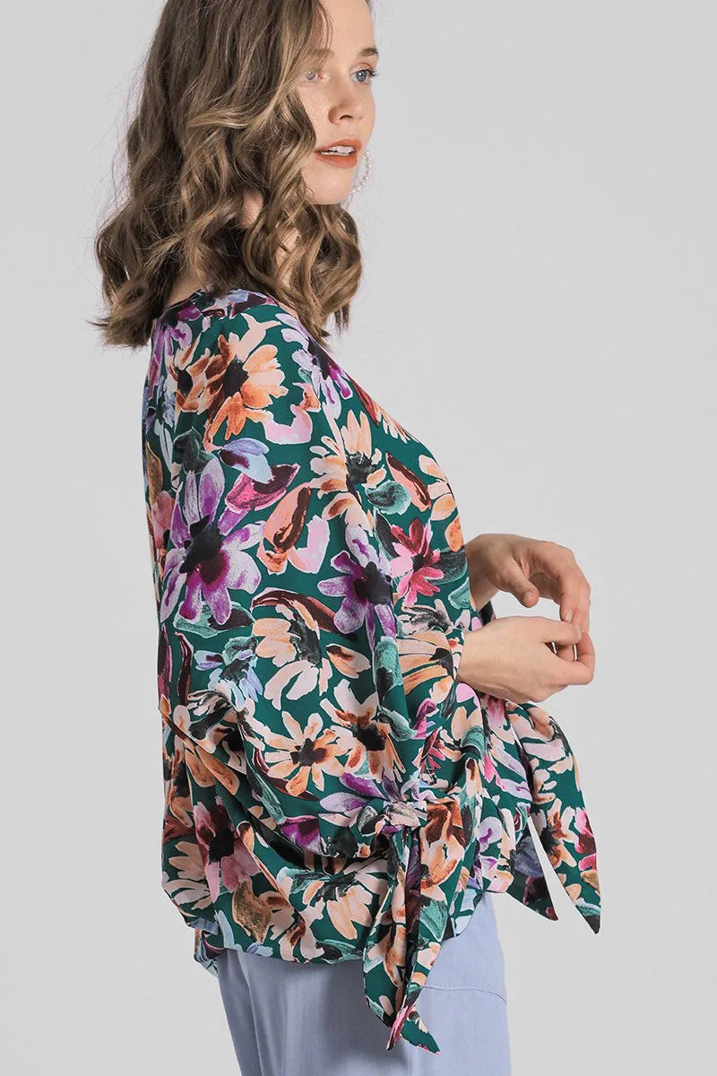 Plus size floral V-neck blouse by Umgee with tie sleeves and full-length floral pattern, perfect for casual or dressy occasions.