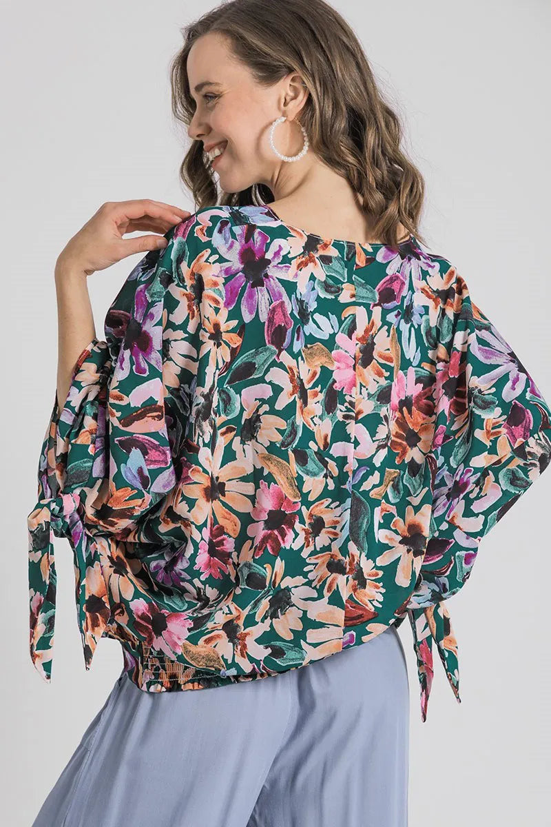 Plus size floral V-neck tie sleeve blouse by Umgee featuring a full-size fit and trendy design, perfect for casual or dressy occasions.