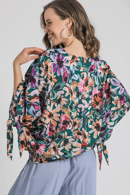 Plus size floral V-neck tie sleeve blouse by Umgee featuring a full-size fit and trendy design, perfect for casual or dressy occasions.