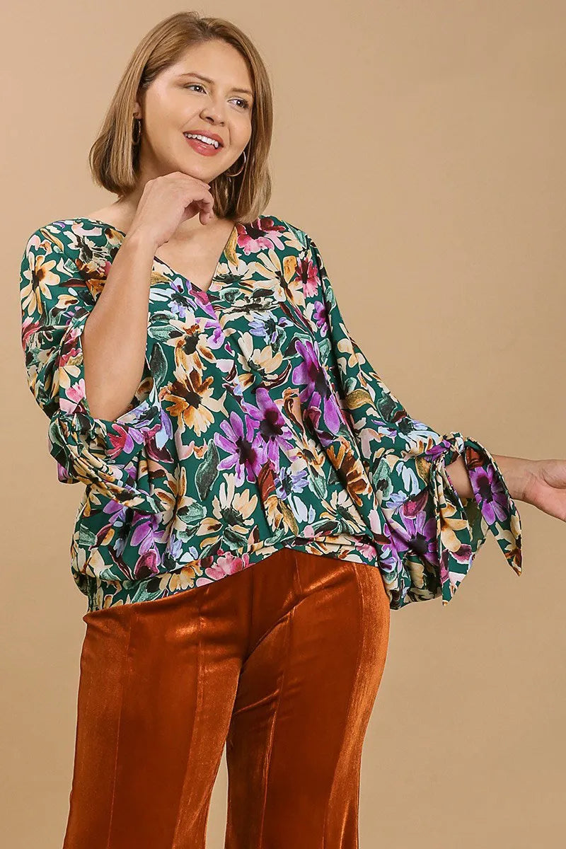 Plus size floral V-neck tie sleeve blouse by Umgee, featuring a full-size fit and stylish design, shown in a trendy floral pattern.