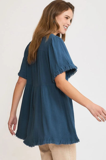 French blue Umgee plus size linen babydoll blouse with raw hem and notched neckline, stylish and comfortable for casual wear.
