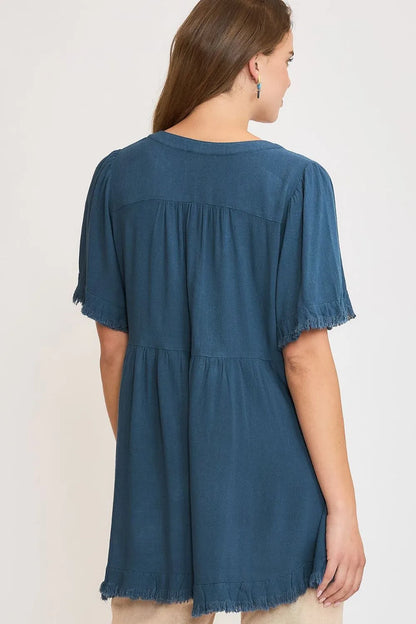 French blue Umgee plus size linen babydoll blouse with raw hem and notched neckline, stylish and comfortable for casual wear.