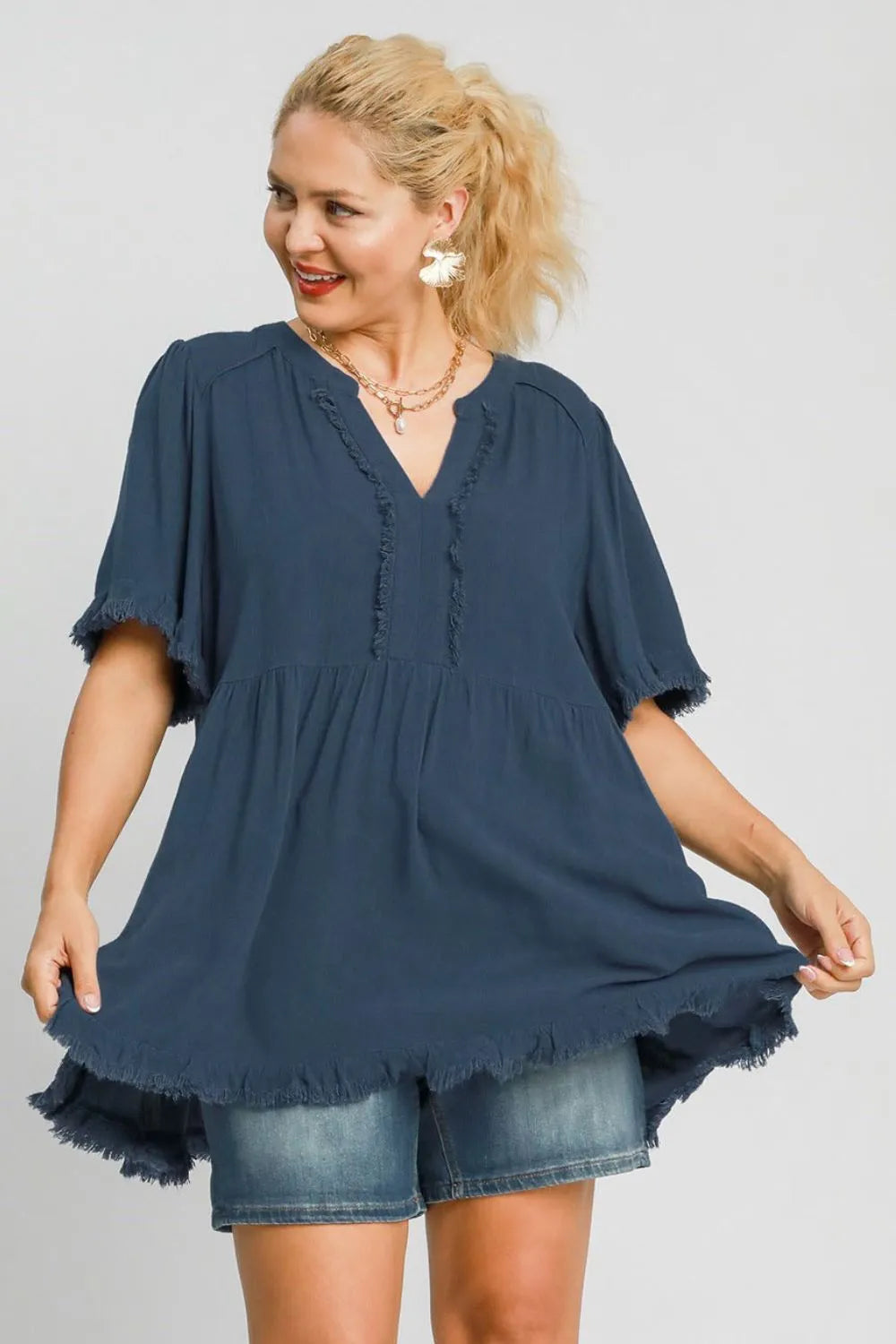 French blue Umgee plus size linen babydoll blouse with raw hem and notched design, stylish and comfortable for casual wear.