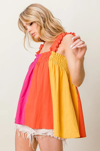 Fuchsia and coral color block BiBi frill shoulder strap bodice top by Trendsi, featuring a stylish and vibrant design.