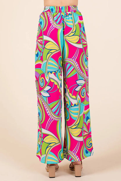 Fuchsia abstract print wide-leg pants with elastic waistband from Mittoshop by Trendsi, showcasing the flowy fabric and vibrant design.