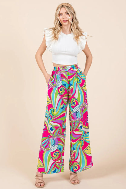 Fuchsia multicolor abstract print elastic waist wide-leg pants by Mittoshop, featuring a relaxed fit and comfortable fabric.