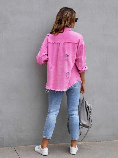 Fuchsia pink distressed drop shoulder denim jacket by Trendsi with frayed edges and relaxed fit, styled on a model.