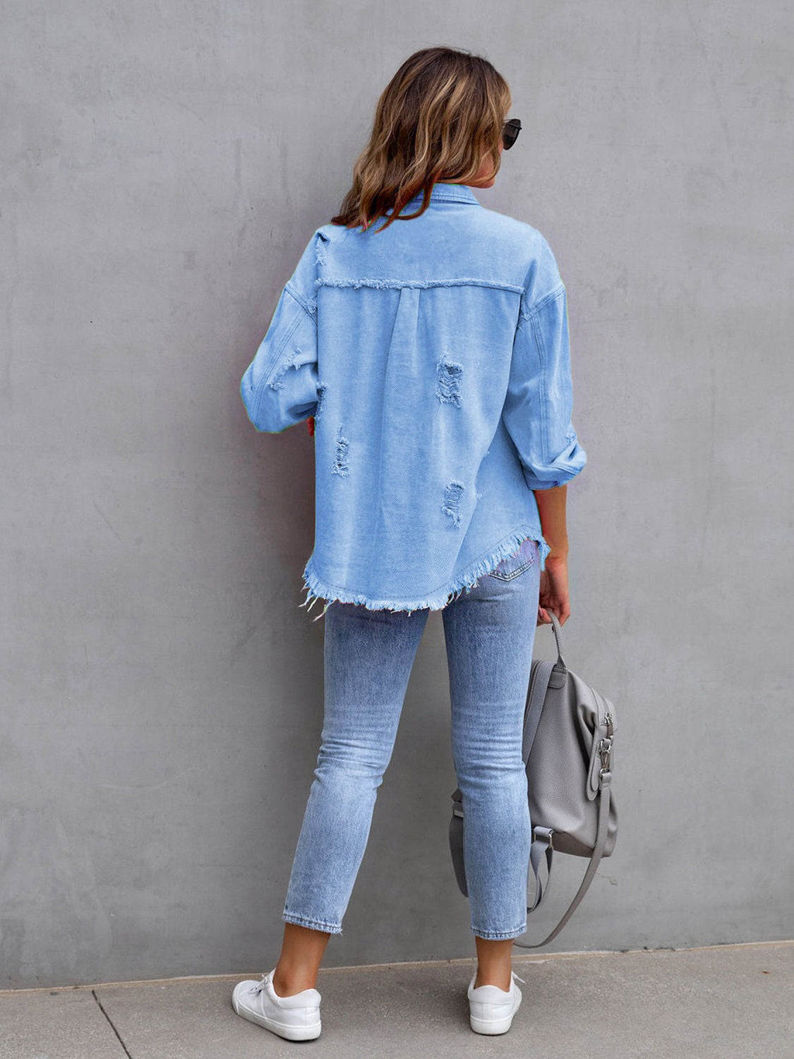 Fuchsia pink distressed drop shoulder denim jacket from Trendsi, featuring a casual, worn-in style and relaxed fit.