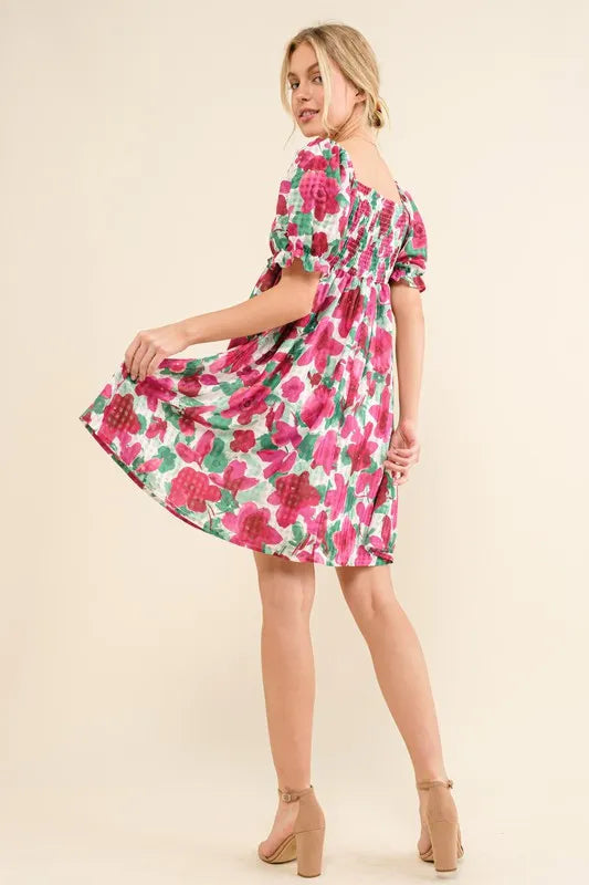 Fuchsia floral smocked mini dress with ruffle short sleeves from Trendsi, featuring a flowy, feminine design.