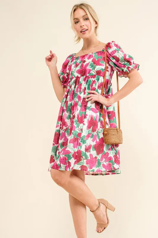 Fuchsia floral mini dress with smocked bodice and ruffled short sleeves from Trendsi, perfect for warm-weather wear.