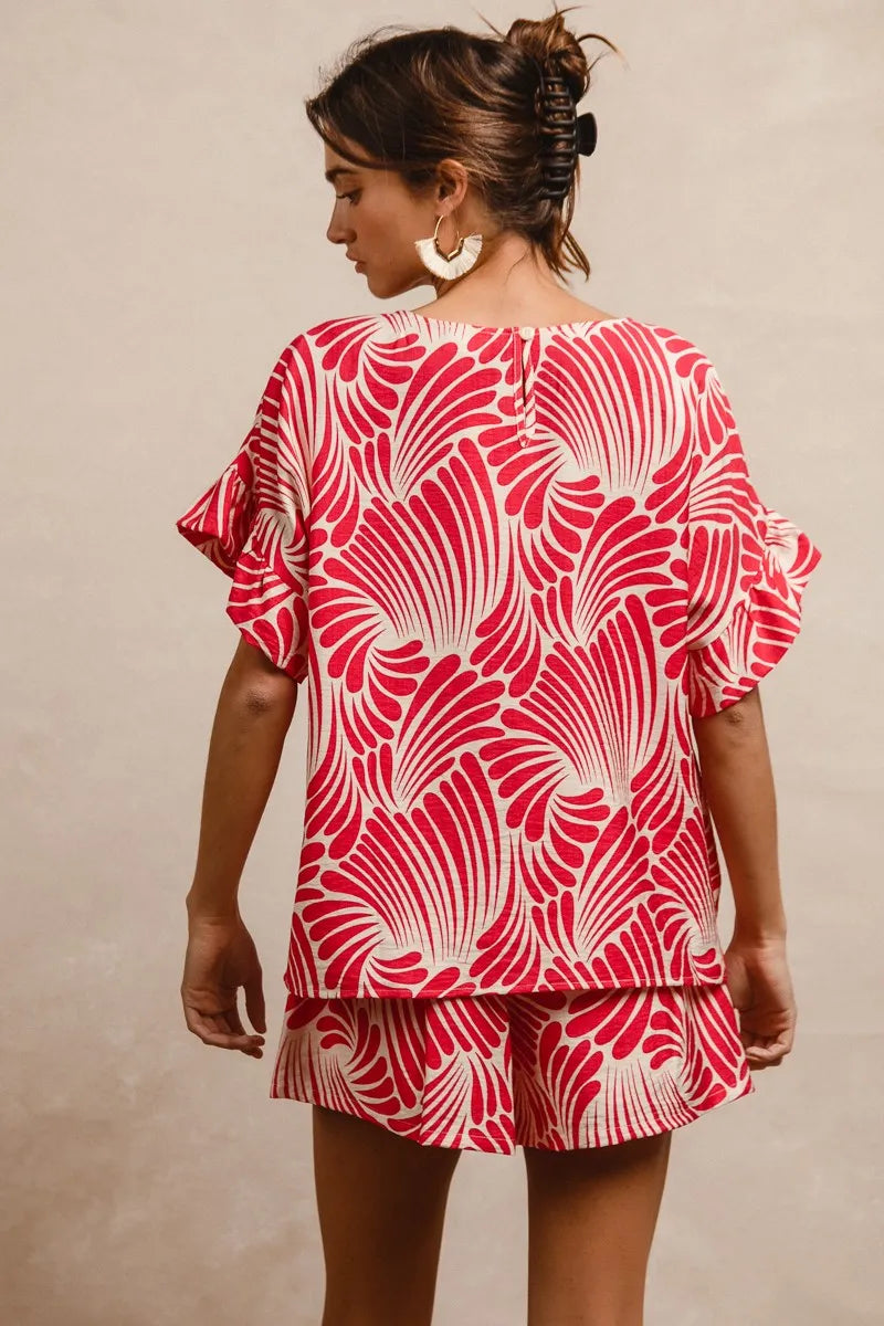 Fuchsia BiBi Print Woven Top with ruffled sleeves, lightweight fabric, and a relaxed fit, perfect for casual or stylish wear.