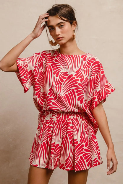Fuchsia BiBi Print woven top with ruffled sleeves, stylish and lightweight, perfect for casual or trendy outfits.