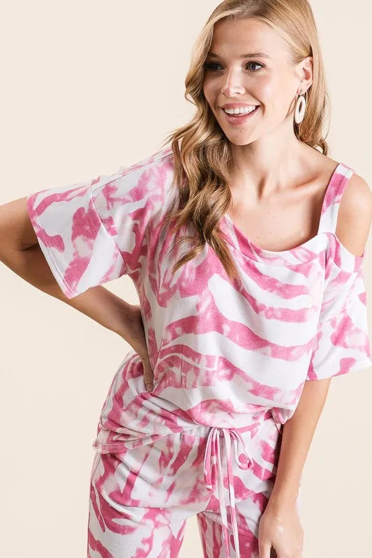 Fuchsia zebra print French terry top and pants set by Trendsi, featuring a comfortable casual outfit with bold zebra pattern.