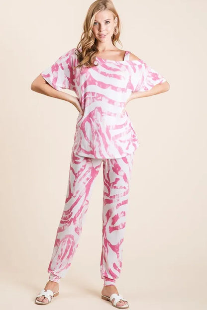 BiBi zebra print French terry top and pants set by Trendsi, featuring a vibrant fuchsia color and comfortable casual style.