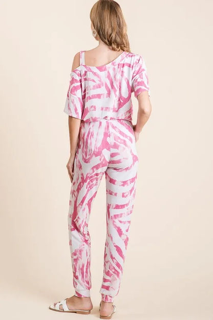BiBi zebra print French terry top and pants set by Trendsi, featuring a vibrant zebra pattern and comfortable casual fit.
