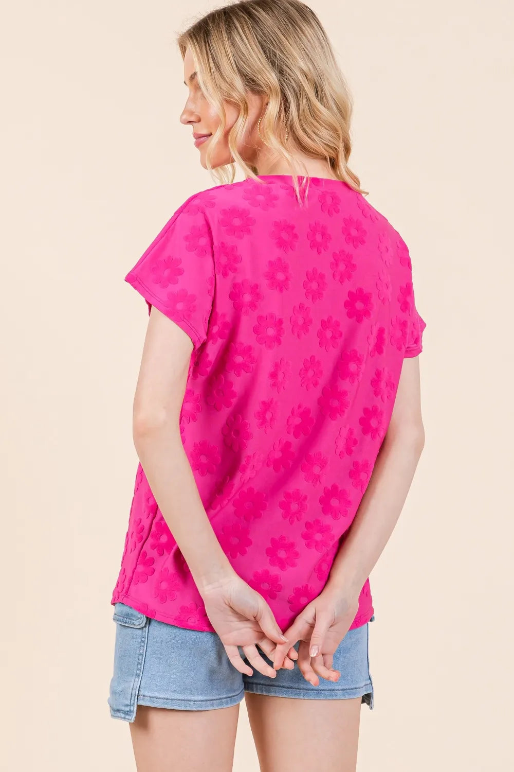 Fuchsia BOMBOM textured floral pattern short sleeve T-shirt from Trendsi, showcasing detailed floral design and casual fit.